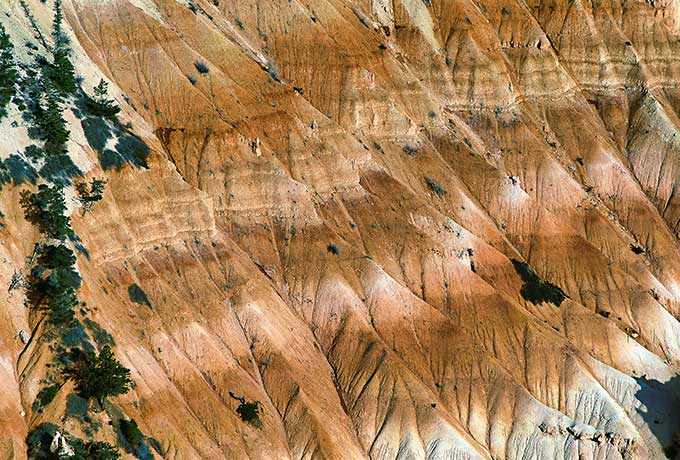 A series of eroded cliffs, brown-beige in color.